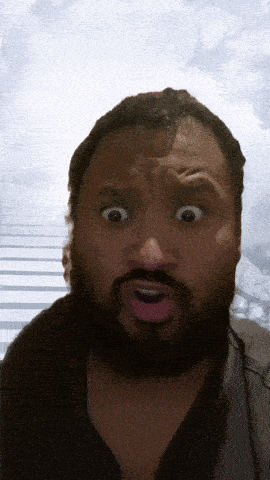 a man with a beard makes a surprised face