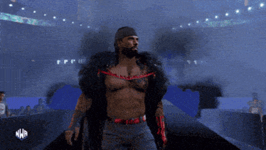 a wrestler is walking down the aisle with a nwa logo in the corner