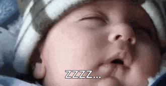 a baby wearing a hat is sleeping with his mouth open and the words `` zzz '' written next to him .