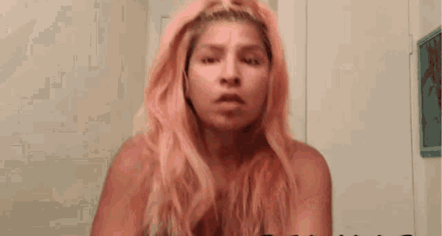 a naked woman with a tattoo on her chest that says i love you