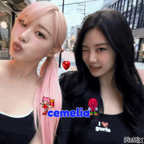 two girls are posing for a picture and one has the name cemelia written on her shirt