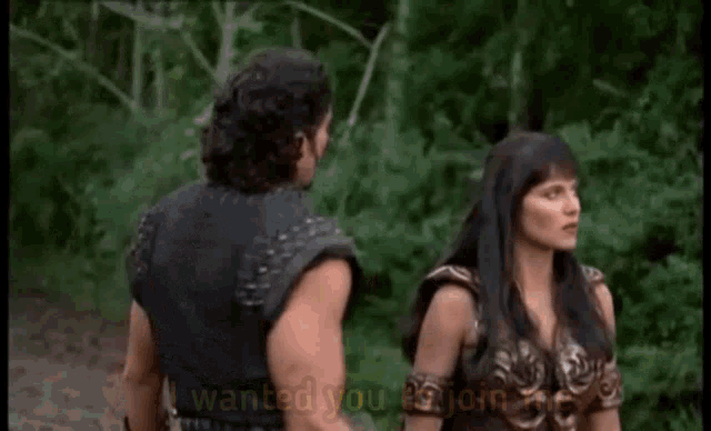 a man and a woman are standing next to each other and the man is saying i wanted you to join me