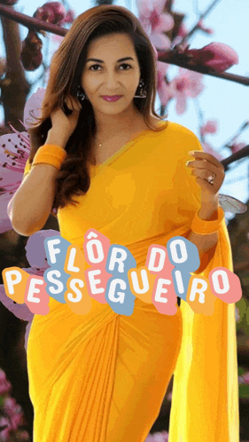 a woman in a yellow dress is standing in front of a tree with flowers and the words flor do pessegueiro