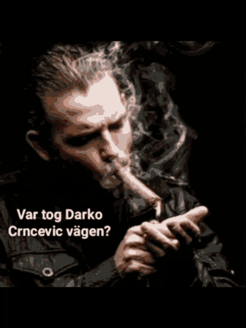 a man smoking a cigar with the words var tog darko crncovic vagn written below him