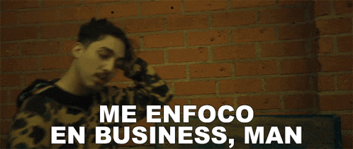 a man talking on a cell phone with the words me enfoco en business man written below him