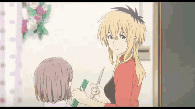 a woman with blonde hair is cutting another woman 's hair with scissors