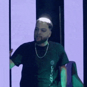 a man with a beard is wearing a black shirt that says ubuntu
