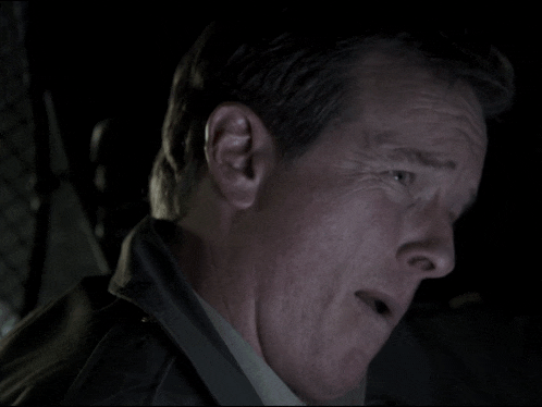 a close up of a man 's face with his eyes closed