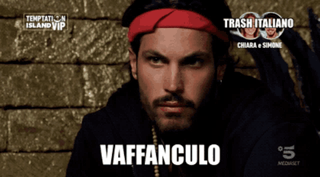 a man with a red headband and the word vaffanculo on the bottom