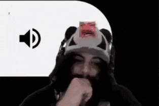 a man wearing a hat with a picture of a man on it is making a funny face .