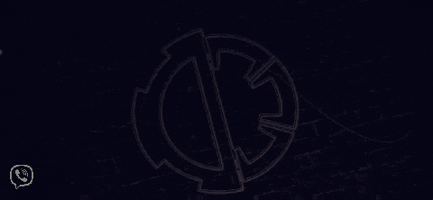 a neon sign on a brick wall shows a circle with two arrows in the middle