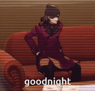 a man in a red coat is sitting on a red couch with the words goodnight written below him