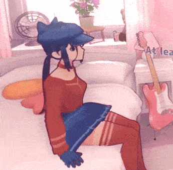 a girl is sitting on a bed in a room with a guitar and a lamp that says at lea