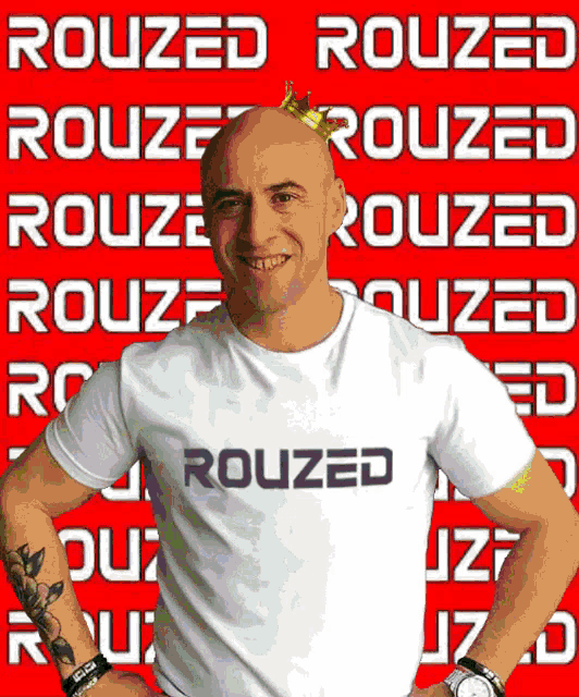 a man with a crown on his head is wearing a rouzed t-shirt
