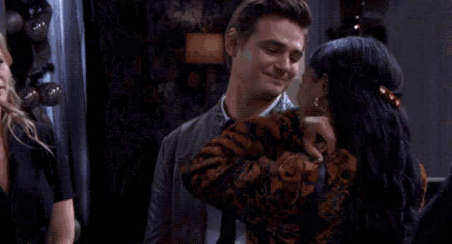 a man and a woman are smiling and laughing together
