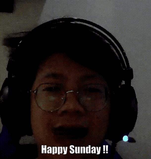 a man wearing headphones and glasses says happy sunday !!