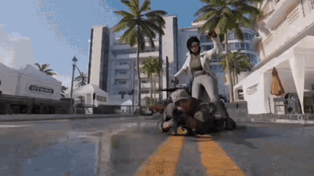 a man is laying on the ground while a woman stands behind him in a video game