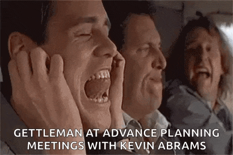 a group of men are sitting on a plane screaming and laughing .