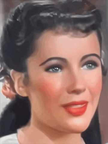a close up of a woman 's face with red lips and blue eyes