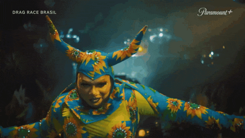 a person in a drag race brasil costume is dancing on paramount +