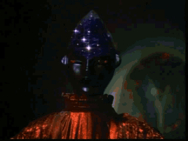 a statue of a man with red eyes and a blue hat on his head