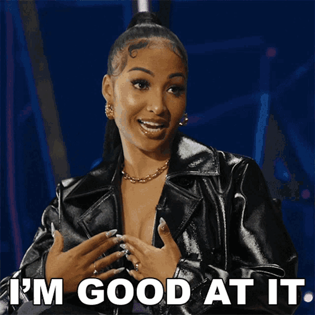 a woman wearing a black leather jacket says i 'm good at it
