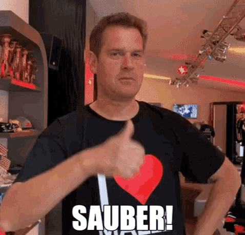 a man wearing a shirt that says sauber on it