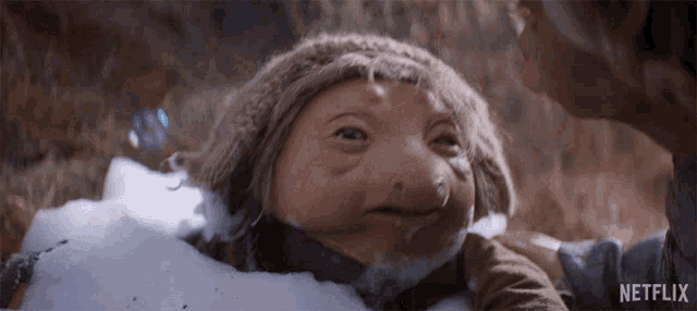a netflix ad shows a person holding a troll in the snow