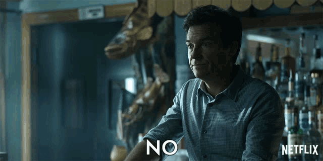 a man sitting at a bar says no in front of a netflix logo