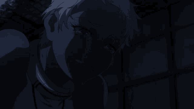 a close up of a woman 's face with a dark background