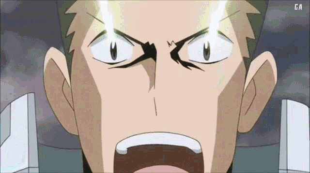 a close up of a man 's face with ga written on the bottom right