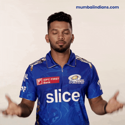 a man wearing a blue shirt with slice on it