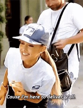 a woman wearing a hat that says ' cause i 'm here to deliver y 'all ' on it