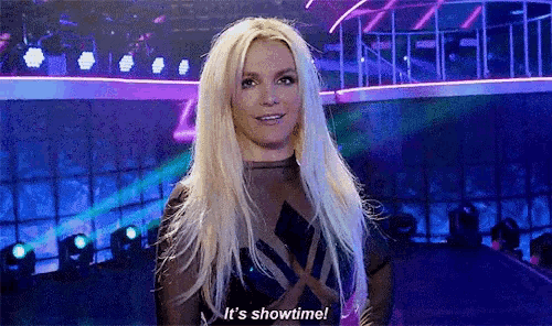 britney spears is standing on a stage talking about showtime .