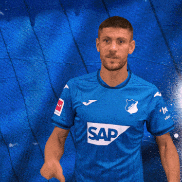 a man in a blue shirt that says sap on it