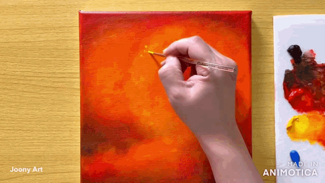 a person is painting a picture with a thermometer in their hand ..