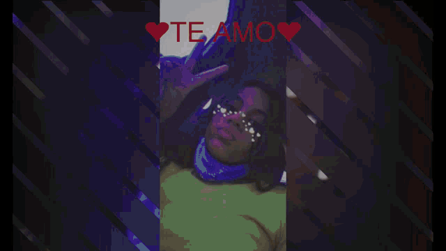 a girl in a purple dress with a heart and the words te amo on the bottom