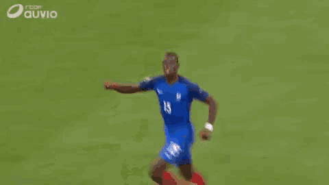 a soccer player in a blue jersey with the number 15 on it is running on a soccer field .