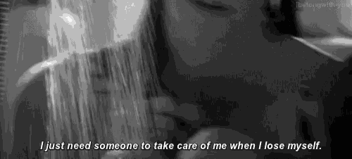 a black and white photo of a person taking a shower with the caption i just need someone