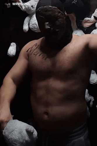 a man without a shirt has a tattoo on his chest that says mama
