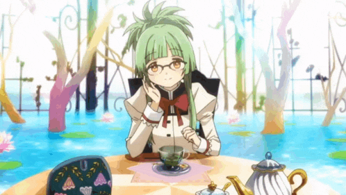 a girl with green hair sits at a table with a cup of tea
