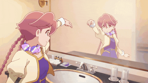 a person 's hand is reaching into a sink with a package of soap behind it