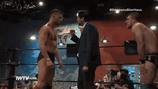 two men in a wrestling ring with the words deppensbierhaus on the bottom