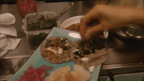 a person is preparing a plate of food with a blue plate