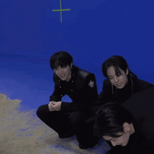 a man in a black shirt is doing push ups