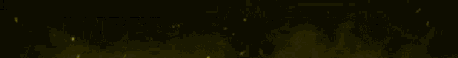 a yellow light is shining on a black background with the letters j and s on it .