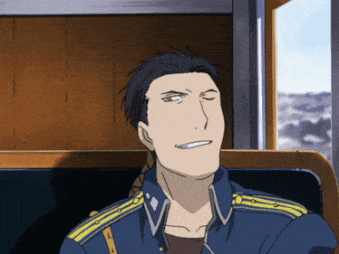 a man in a blue uniform with yellow stripes on the sleeves is smiling