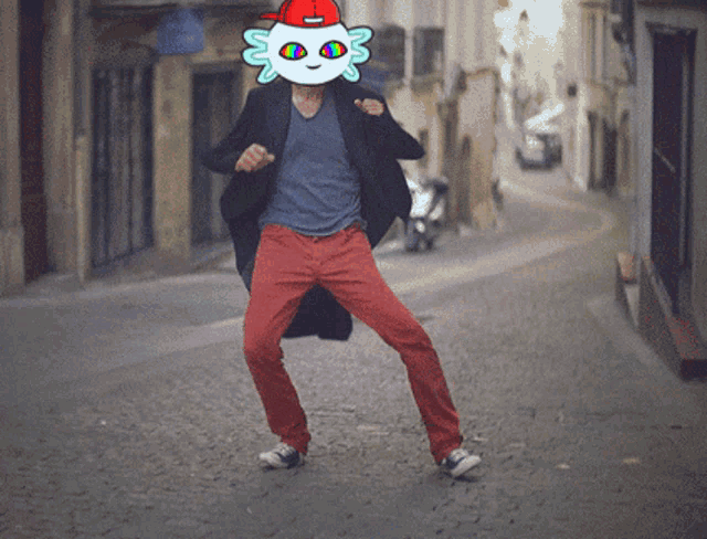 a man wearing red pants and a black jacket has a cartoon face on his face