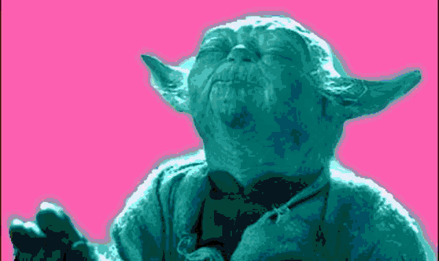 a close up of a statue of yoda with his eyes closed