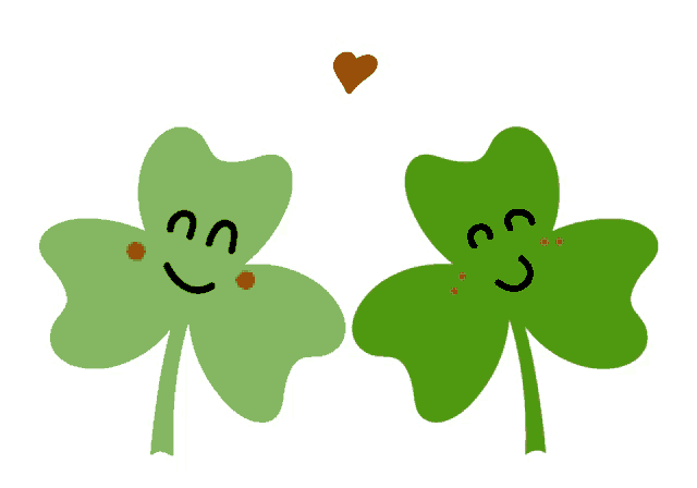 a couple of clovers with faces and a heart above them